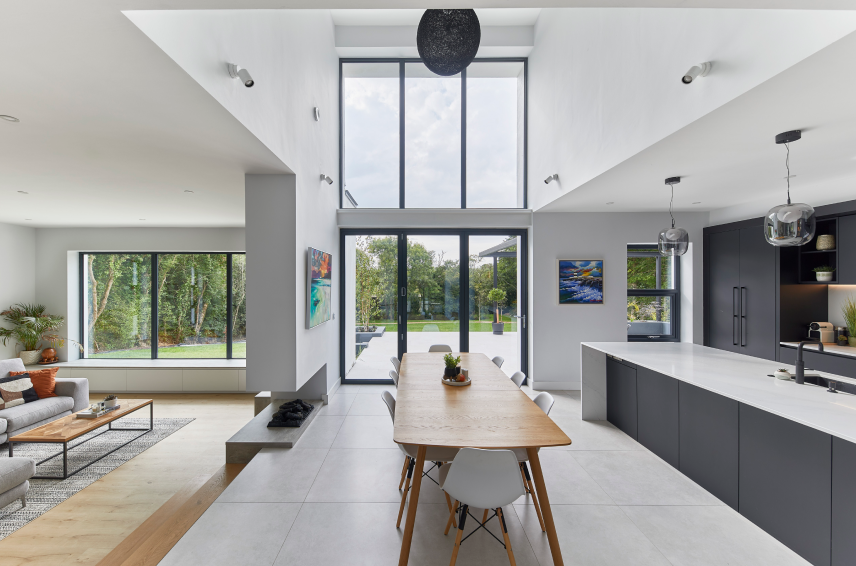 Modern open-plan home with large aluminium windows and sliding doors