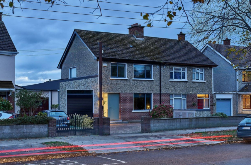 Semi-detached house featuring new aluminium windows and entrance door during a home refurbishment - Senator Windows